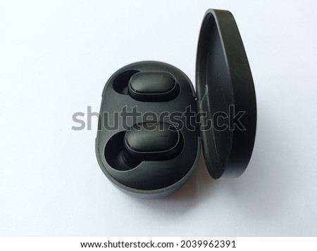 black wireless headset on isolated background
