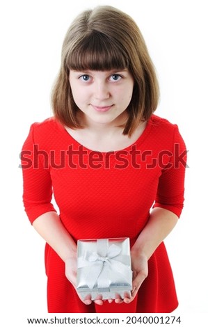An image of young girl with gift box on white