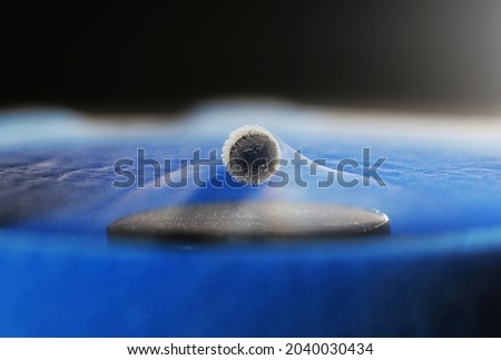 Superconductivity is a set of physical properties observed in certain materials where electrical resistance vanishes and magnetic flux fields are expelled from the material.  Royalty-Free Stock Photo #2040030434