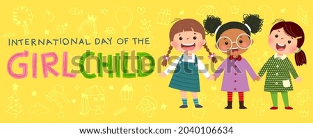 International Day of the girl child background with three little girls holding hands on yellow background. Royalty-Free Stock Photo #2040106634