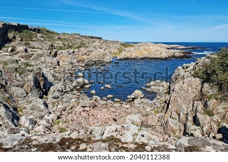 Rocky shore in a small island of the Baltic sea. ChristianSo population are 84 people