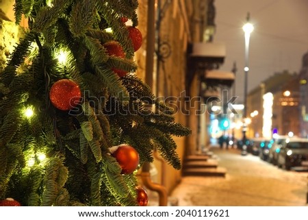 Christmas decoration on city street in winter.
