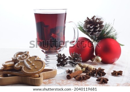 Mulled wine and cookies on the table on a light background.