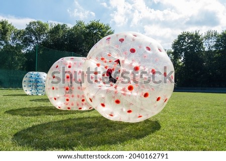 Inflatable bumper bubble ball, human hamster. Royalty-Free Stock Photo #2040162791