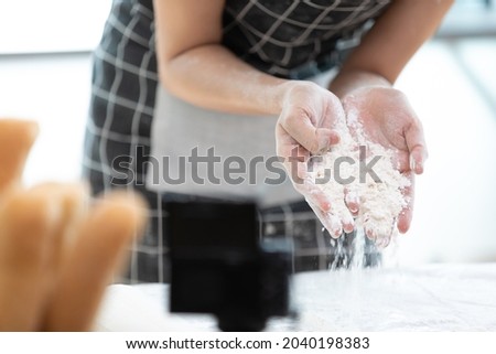 close up chef hands showing white flour for make a bread