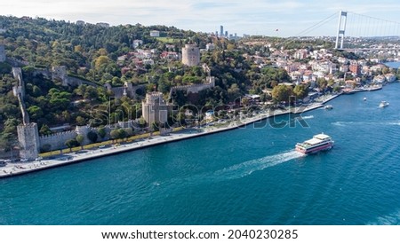 Aerial view of Rumeli Fortress and Bosphorus Bridge with drone, Rumeli hisari and Bogaz Koprusu - Istanbul - Turkey