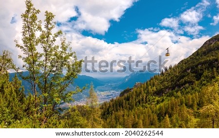 View to Garmisch-Partenkirchen Bavaria and Kreuzeckbahn - Kreuzeck Cable car and the Wank mountain in background. mountain range Estergebirge mountains. Eckenberg, views from the top of the hill. Royalty-Free Stock Photo #2040262544