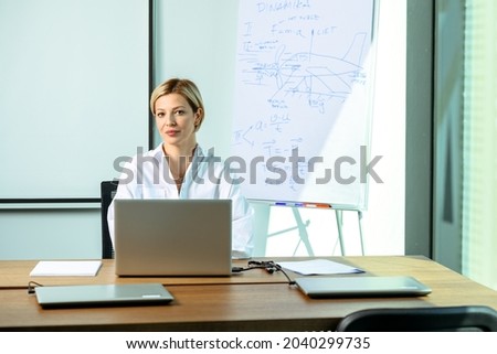 Female corporate portrait. businesswoman at work. Short hair blonde portrait. Human resource office. Business attire portrait. Female entrepreneur. Sales manager at work. 
