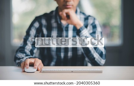 Searching Browsing Internet Data Information with blank search bar. man's hands are using a computer keyboard to Searching for information. Using Search Console with your website.