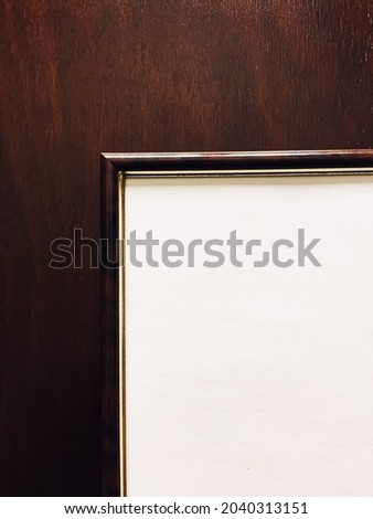 Blank picture frame on wooden background, luxury home decor and interior design, poster print and printable art mockup.