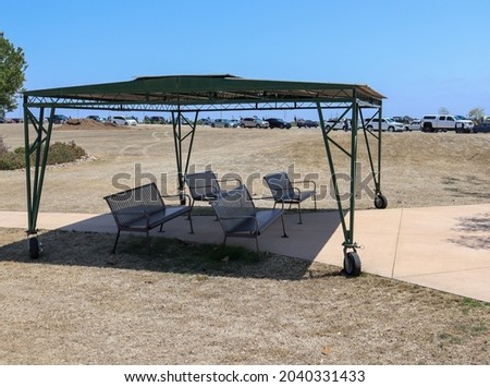 A heavy duty shade with caster wheels.