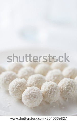 Coconut cakes light dessert in the form of balls on a light background Royalty-Free Stock Photo #2040336827