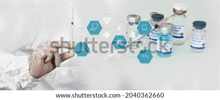 Medical doctor injecting coronavirus vaccine, COVID-19 vaccine, Medicine digital healthcare and connection on modern virtual screen. 