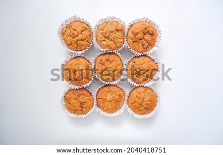 Fresh, delicious cupcakes on a white background. Photo from above, Dessert, pastries, delicious food. Minimalism