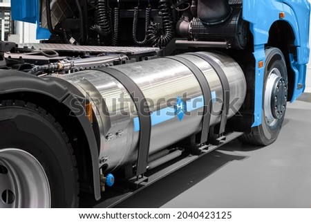 A hydrogen fuel cell semi truck with H2 gas cylinder onboard. Eco-friendly commercial vehicle concept Royalty-Free Stock Photo #2040423125
