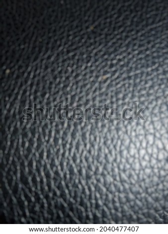 Abstract defocused background of black leather