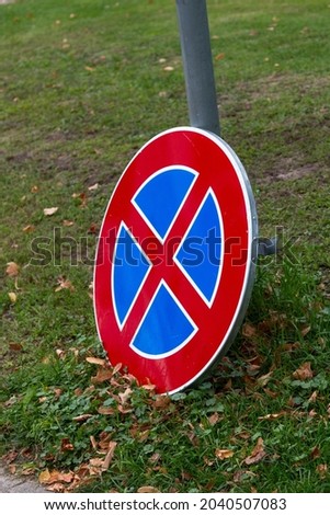 broken No stoping and parking sign. The concept of parking restrictions or motion restoration concept