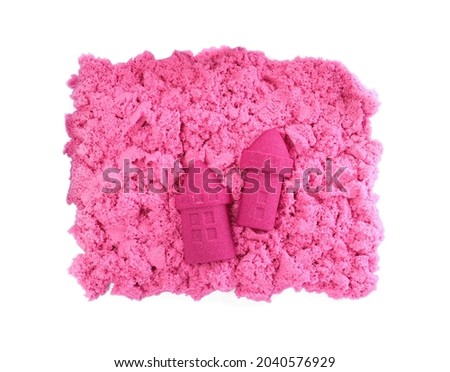 Castles made of kinetic sand on white background, top view