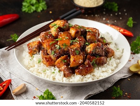 Chinese traditional cuisine sticky braised pork belly with rice on white plate. Royalty-Free Stock Photo #2040582152