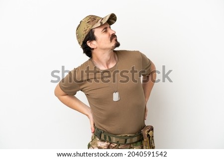 Soldier man isolated on white background suffering from backache for having made an effort