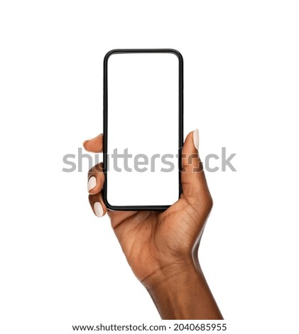 Close up of mature african hand holding smartphone with blank screen isolated on while background. Black woman showing empty screen of modern cellphone. Mature hand showing white screen of smart phone Royalty-Free Stock Photo #2040685955