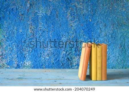 row of books, grungy background free copy space 