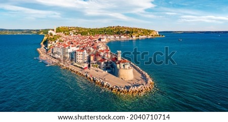 Attractive morning cityscape of Piran town. Splendid summer scene of Slovenia’s Adriatic coast with beautiful Venetian architecture. Exciting Mediterranean seascape. View from flying drone. Royalty-Free Stock Photo #2040710714