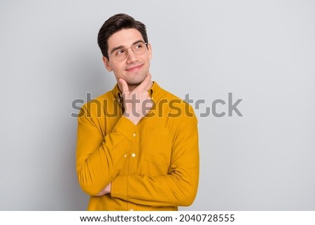 Portrait of attractive bewildered cheerful man manager thinking copy space isolated over grey color background Royalty-Free Stock Photo #2040728555