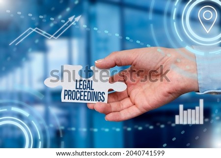 Sign displaying Legal Proceedings. Conceptual photo procedure instituted in a court of law to acquire benefit Hand Holding Jigsaw Puzzle Piece Unlocking New Futuristic Technologies. Royalty-Free Stock Photo #2040741599