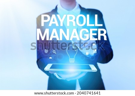 Text sign showing Payroll Manager. Business overview Maintains payroll information by designing systems Woman In Uniform Holding Mobile Phone Showing Futuristic Virtual Icons