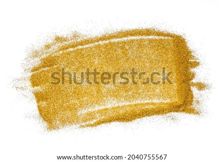 Gold glitter on white background. Abstract brush strokes texture.