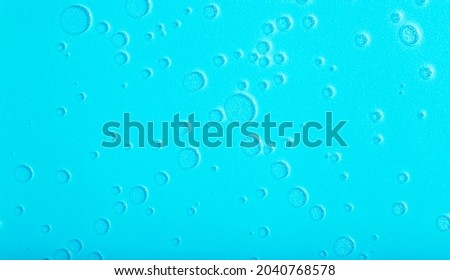 Blue liquid abstract background. Bubbles and textures of water on a blue background 