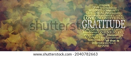 Words of Gratitude Thanksgiving Circular Message Banner - an autumnal multicoloured wide rustic grunge leaf background with GRATITUDE word cloud on right and copy space on left 
