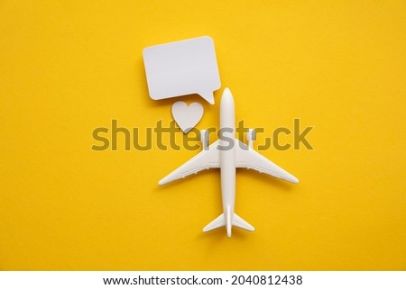 Airplane with a blank speech bubble. Flight feedback and holiday communication background