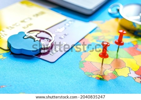 Travel preparation and booking with credit cards on map