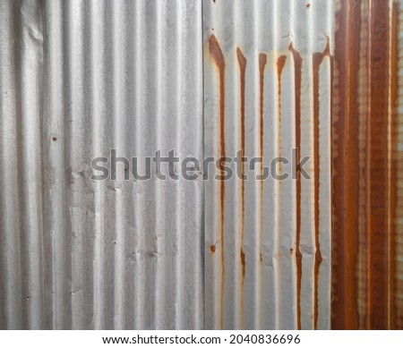 Metal steel strips. Rusty corrugated iron metal, Zinc steel wall, pattern texture background. Close-up of exterior architecture material for design decoration background.