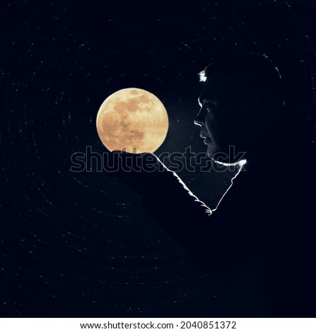 man looking on golden full moon . backlight.