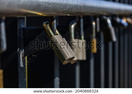 Love Locks Hanging on the Rail Among Others Variegated Padlocks