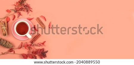 Seasonal background with maple leaves, cinnamon and tea. Autumn composition flat lay,, place for text. Happy Thanksgiving concept, greeting card, banner for screen, top view, selective focus
