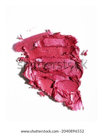 Smudged lipstick, abstract texture background, top view