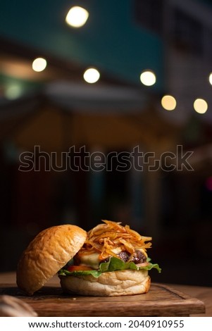 Beef burgers with caramelized onions. Burgers with artisan bread Royalty-Free Stock Photo #2040910955