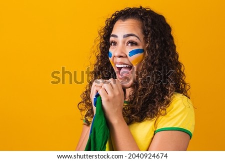 brazilian fan with her face painted in blue and yellow for the brazil game. Brazilian celebrating the independence of Brazil. September 7th
