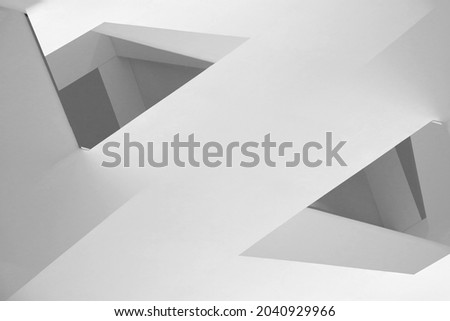 Collage photo of wall corners resembling abstract modern architecture and interior design. Minimal geometric background in light gray halftones. Angular or polygonal structure of surfaces and edges.