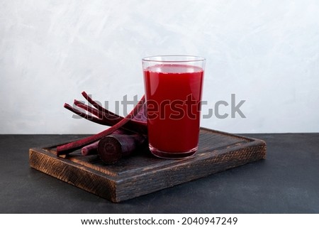 Salgam or fermented beet juice. Popular Turkish drink. Traditional beverage made with water, purple carrot or turnip (juice). Selective focus, copy space. Royalty-Free Stock Photo #2040947249