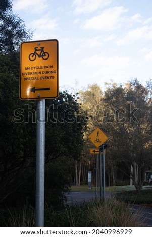 Warning yellow M4 cycle bicycle path diversion during special events, and cyclist allowed.