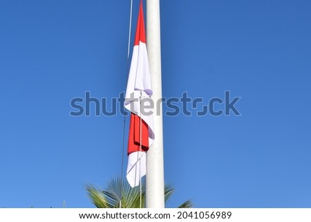 Indonesia flag with blue sky background. Selective focus.