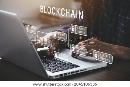 Businessman using a computer to Blockchain technology concept with a chain of encrypted blocks to secure cryptocurrencies and bitcoin for online payments and money transaction Royalty-Free Stock Photo #2041106336