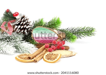 New Year and Christmas 2022, holiday decorations isolated on white background with the flag of Abrosexuality engraved on a tree cut.