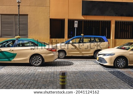 Taxi car parked at downtown in Dubai. United Arab Emirates