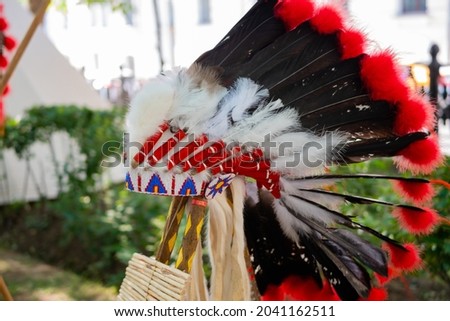 Roach - traditional Native American male headdress at summer outdoor historical festival: close up - nobody, no people. Ethnic, costume, culture, traditional and reenactment concept Royalty-Free Stock Photo #2041162511